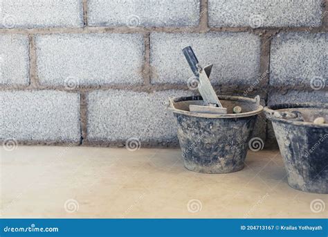 cement tank  scoop  brick blocks  construction area stock
