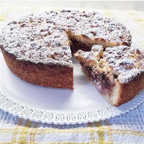 A Cake On A Plate With One Slice Cut Out