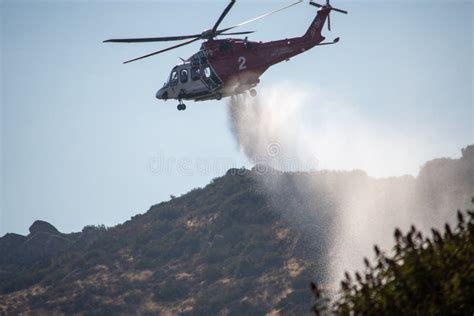 A Lafd Augustawestland 139 Helicopter Makes A Water Drop On A Brush