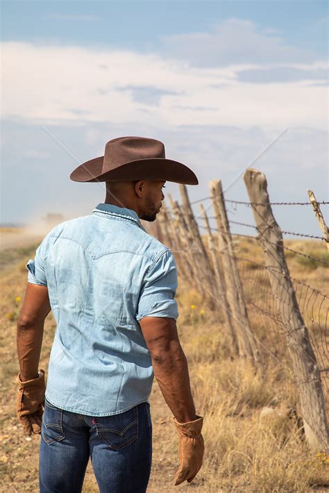 Cowboy By A Rustic Fence On A Ranch Rob Lang Images