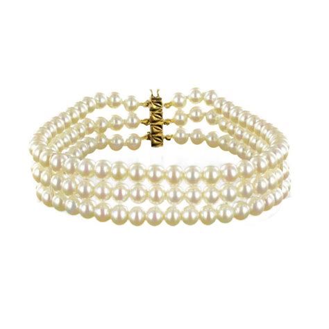 Bracelet neuf indémodable 3 rangs de perles de culture orient blanc