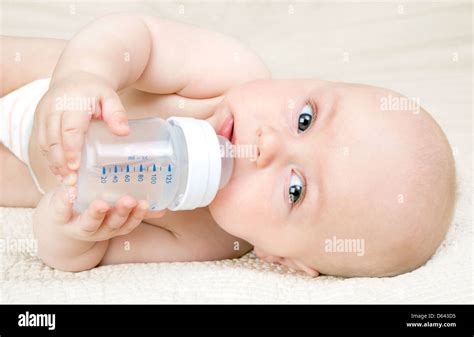 Baby with a water bottle Stock Photo - Alamy