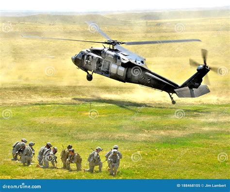 Infantry Squad Waiting For The Blackhawk Helicopter To Land Editorial