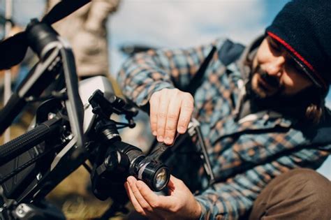 Premium Photo Man Pilot Checking Quadcopter Drone Before Aerial