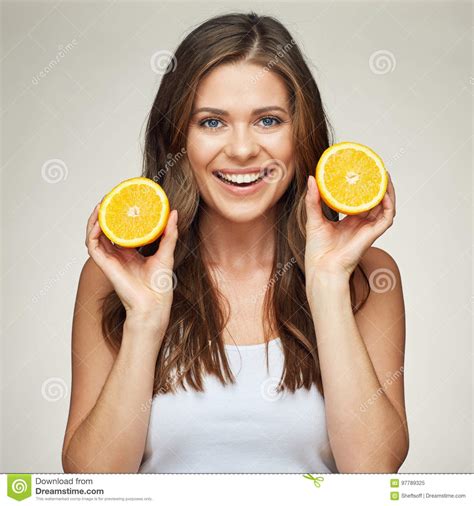 Smiling Woman Holding Orange Fruit Studio Isolated Portrait Stock