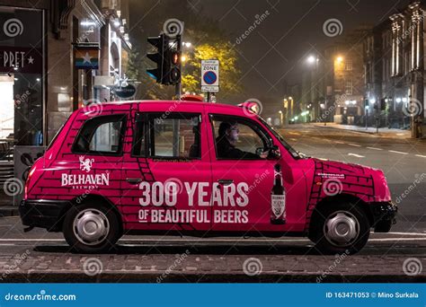 Typical British Taxi Cab Tx4 In The Night Streets Of Edinburgh With