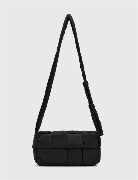 Bottega Veneta The Padded Tech Cassette Messenger Bag Hbx Globally Curated Fashion And