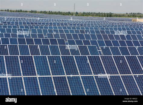 Solar Panels Under Blue Sky Stock Photo Alamy