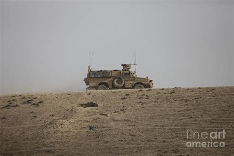 An Mrap Vehicle Patrols The Ridge Photograph By Terry Moore Fine Art America