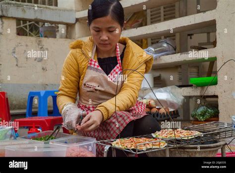 Local Street Vendor Making Vietnamese Pizza In Sapa Vietnam Stock