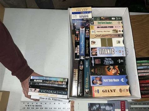 Assorted VHS Movies DVDs Cassette Tapes Legacy Auction Company