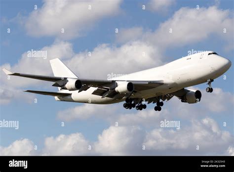 A Boeing 747 cargo freighter plane landing at Miami Airport Stock Photo - Alamy