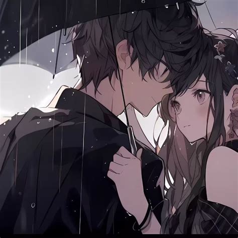 Two People Standing Under An Umbrella In The Rain