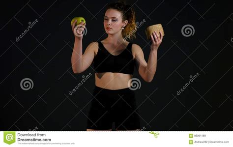 Portrait Of A Happy Fat Woman Choosing Between Burger Or Apple Isolated