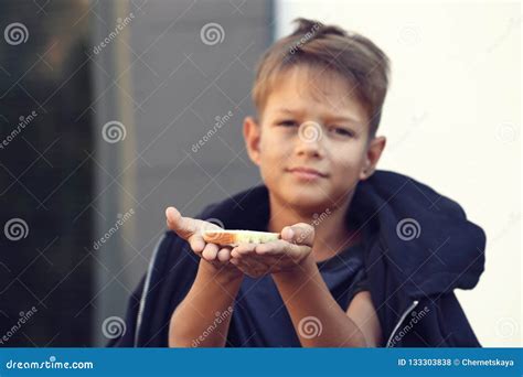 Poor Little Boy with Bread on Street Stock Photo - Image of homeless ...