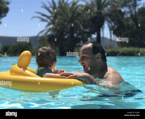 Father and son in swimming pool Stock Photo - Alamy