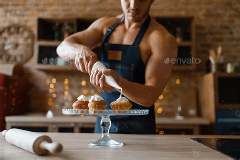 Nude Man In Apron Cooking Dessert On The Kitchen Stock Photo By NomadSoul1