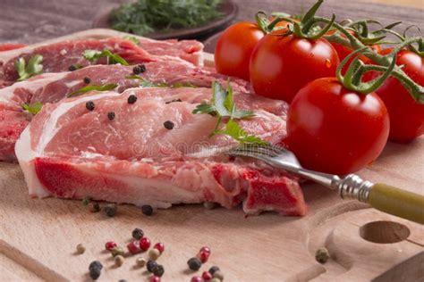 Fresh Raw Pork Chop Meat On Cutting Board Stock Photo Image Of Cutlet