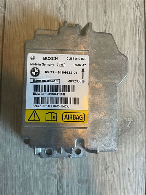 MODUŁ SENSOR PODUSZEK BMW E90 E92 AIRBAG 12289967980 oficjalne