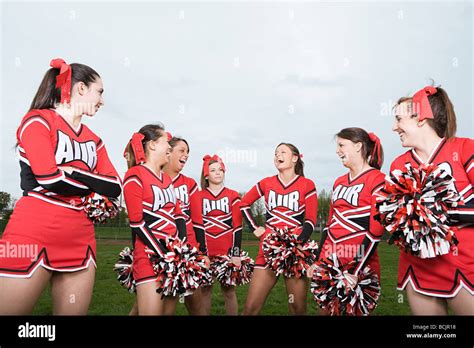 Cheerleaders laughing Stock Photo - Alamy