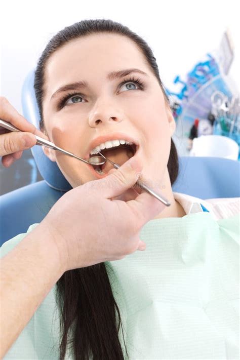 Dentist Examines The Oral Cavity Of The Patient Stock Image Image Of