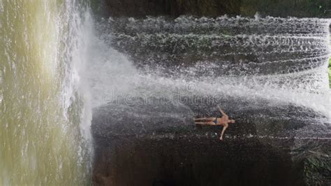 Handsome Man With Naked Torso Swimming Towards The Video Camera Slow