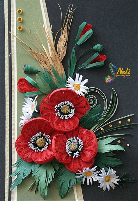 An Arrangement Of Flowers And Feathers On A Black Surface With Gold