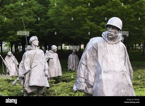 A Group Of Statues Represent A Squadron On Patrol At The Korean War