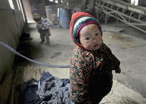 Tethered But Safe Chinese Workers Forced To Tie Their Youngsters Up At