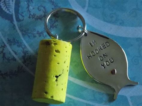 A Cork Keychain That Says I M Hooked On You Next To A Bottle Opener