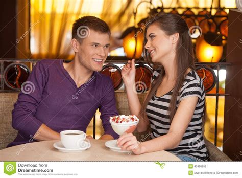 Beautiful Couple Sitting In Cafe And Eating Stock Image Image Of