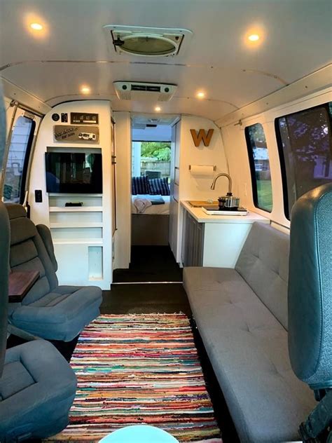 GMC Motorhome Interior with Couches and Kitchen Area