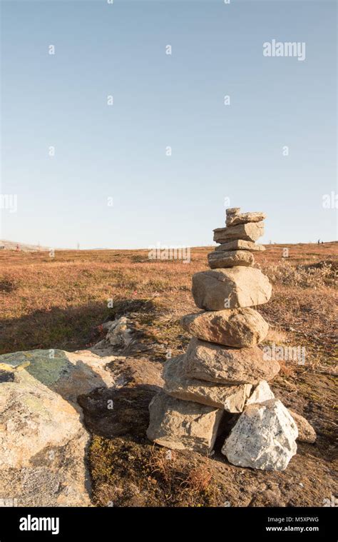 Tall Stack Of Natural Irregular Stones Balanced On Top Of One Another