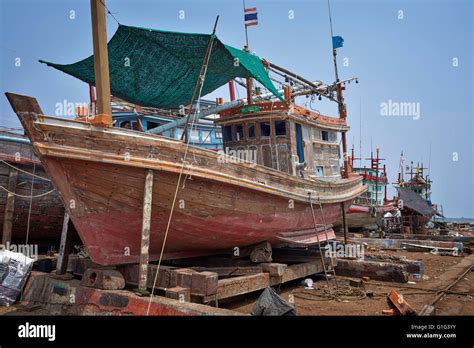 Traditional Thai Wooden Commercial Fishing Boat Undergoing Repair And