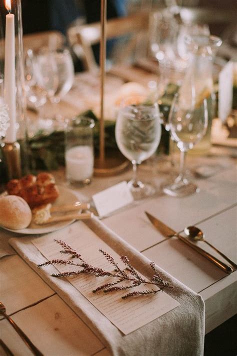 The Table Is Set With Place Settings And Silverware For Guests To Sit