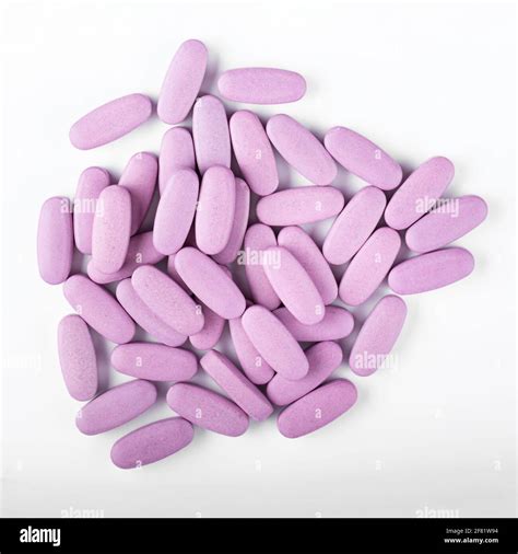 Purple Pills On A White Background Global Health Care Concept