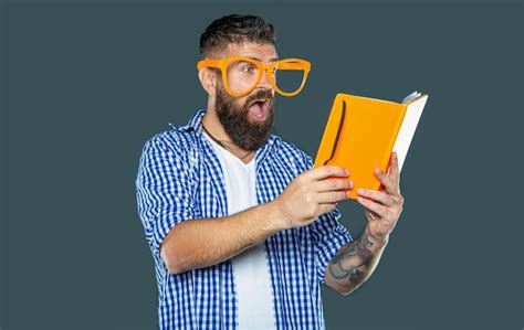 Premium Photo Funny Bearded Man In Party Glasses Reading Book