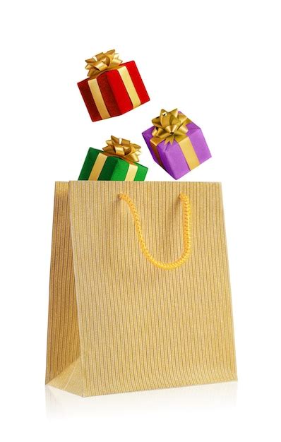 Las Cajas De Regalo Multicolores Caen En Una Bolsa Dorada Aislado En