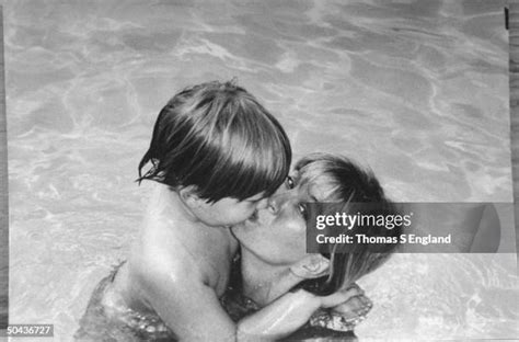 Future murder victim Sara Tokars cuddling her son Ricky in swimming ...