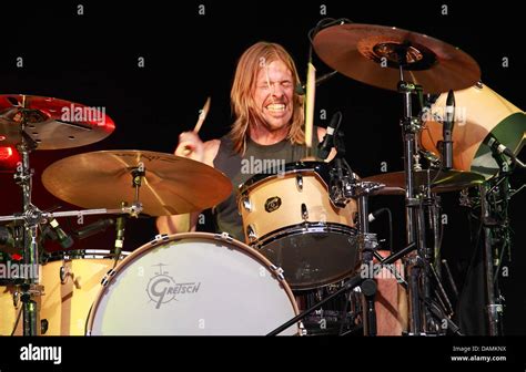 Taylor Hawkins, drummer of the US rock band 'Foo Fighters', plays on stage at the Wuhlheide open ...