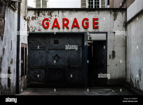 Old Abandoned Garage With Red Sign In Historical Center Of Strasbourg