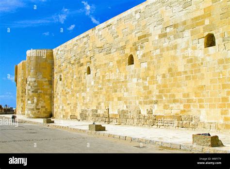 Exterior stone wall of the medieval castle Stock Photo - Alamy