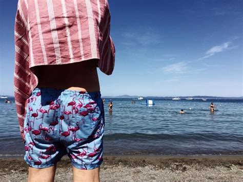 Premium Photo Rear View Of Man Standing At Beach Against Sky