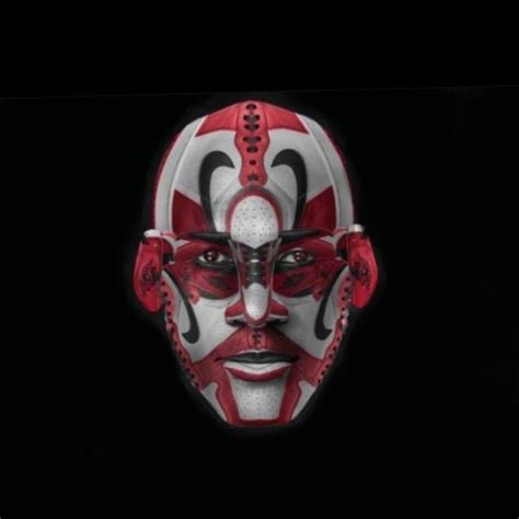 A Red And White Mask On A Black Background