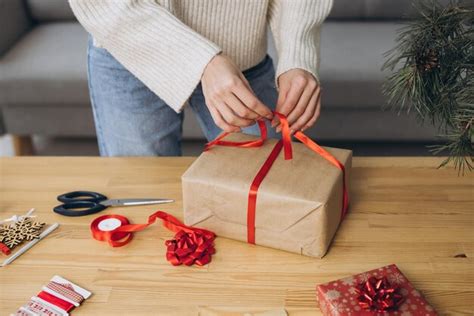 Premium Photo Woman Wrapping Christmas Presents Gifts