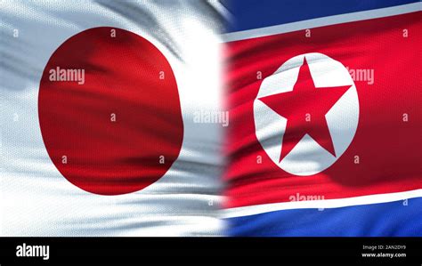 Japan and North Korea flags background, diplomatic and economic ...