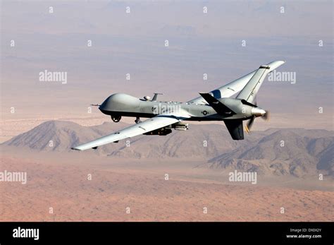 A US Air Force MQ 9 Reaper Unmanned Aerial Vehicle Armed With GBU 12