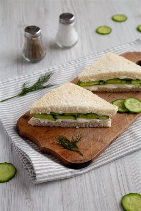 Homemade English Cucumber Sandwiches On A Rustic Wooden Board Side