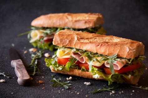 Premium Photo Baguette Sandwich With Cheese Ham Tomatoes And Vegetables