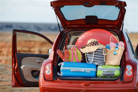 Suitcases And Bags In Trunk Of Car Ready To Depart For Holidays Stock